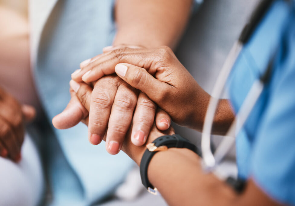 Empathy, trust and nurse holding hands with patient for help, consulting support and healthcare advice. Kindness, counseling and medical therapy in nursing home for hope, consultation and psychology.